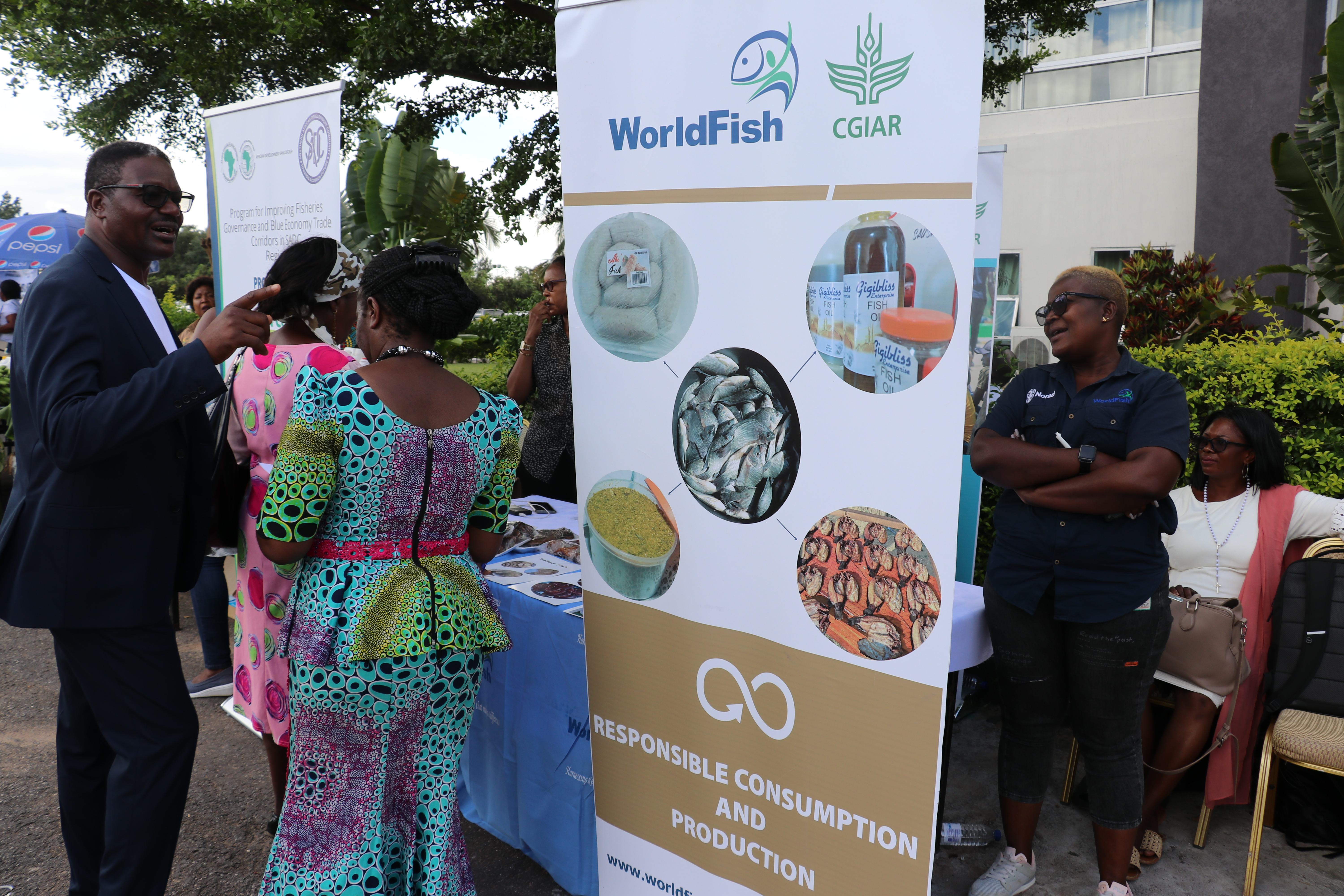 CEEC CEO Dr. Mungule interacts with SMEs at the WorldFish booth
