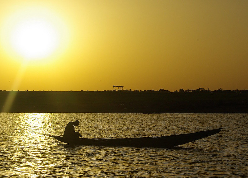 Fisher at dusk, Kainji Lake, NW Nigeria.