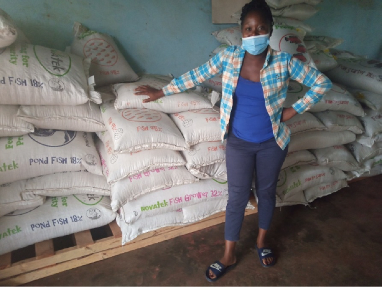 An entrepreneur at her fish feed outlet in Mporokoso district. Photo by Mercy Sichone.