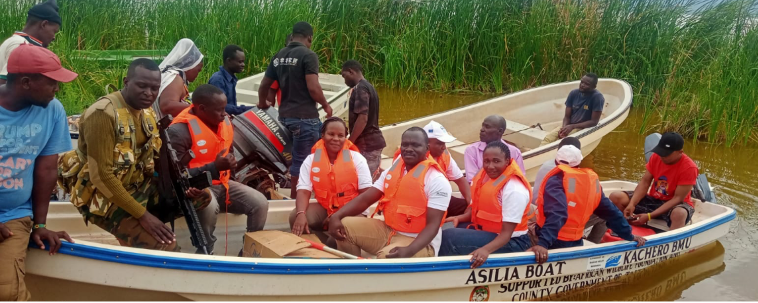 Mercy Matuma Hamisi in the field with other students to learn about the types of fish diseases and biosecurity technique at Lake Jipe in Kenya. Photo taken by Cidee khaseke and Finnan Ageng'o, WorldFish.