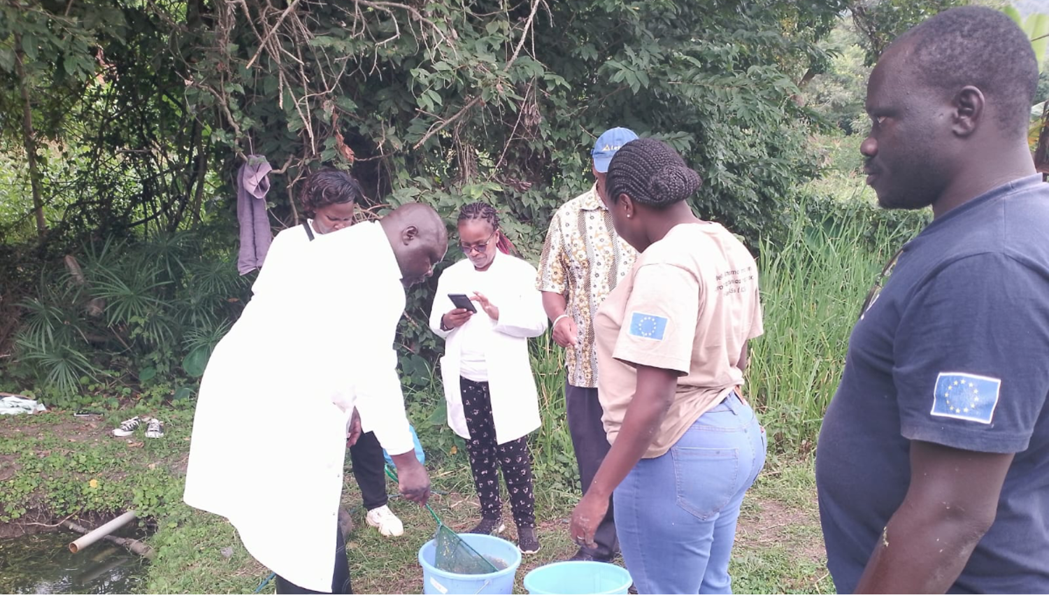 Mercy Matuma Hamisi collecting data on aquatic animal health with her fellow student researchers at the University of Nairobi in Kenya. Photo by Cidee khaseke and Finnan Ageng'o, WorldFish.