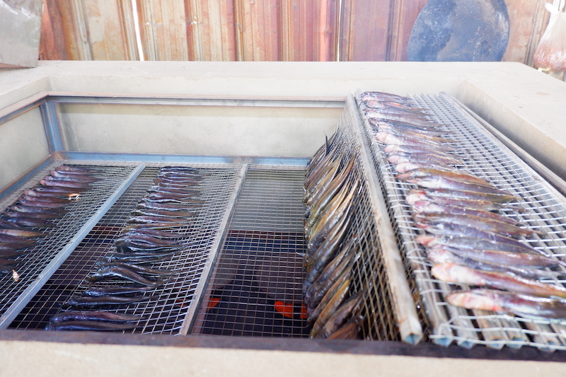 Catfish is being smoked using the newly installed smoking kiln. Photo by Kyaw Moe Oo.