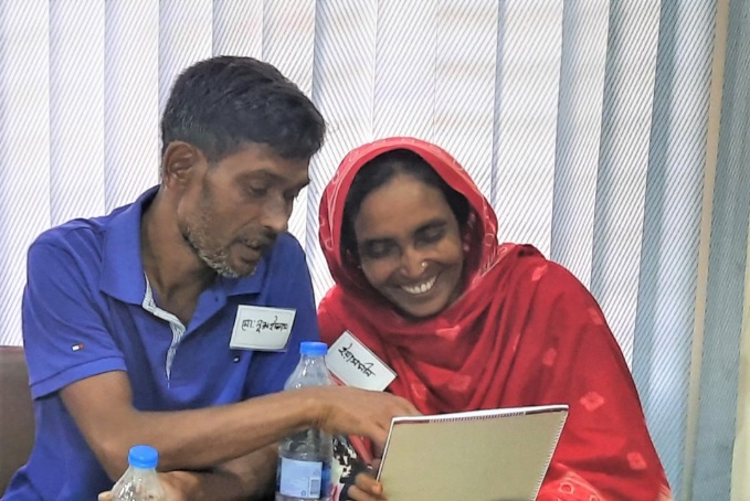 : Yeasmin Ara and Nurul Islam learning the importance of cash flow. Photo by Maherin Ahmed.