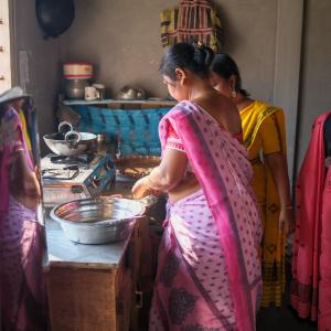 Preparing mola, a small, nutrient-rich fish, for cooking, a traditional and important source of vitamins and minerals in local diets in Assam. Photo by WorldFish.