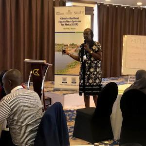 Suzanne Kuria of AWFISHNET explaining their approach to capacity building and market access for women