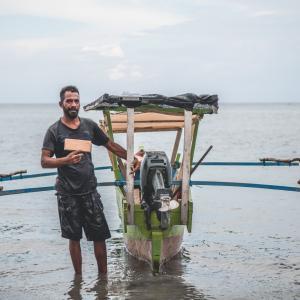 Handline fisher with tracker Timor-Leste © Joctan Lopes/WorldFish