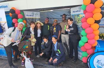 Entourage from Japan visits the WorldFish stand. Photo: Agness Chileya