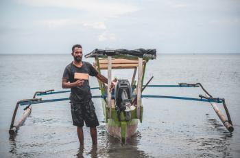 Handline fisher with tracker Timor-Leste © Joctan Lopes/WorldFish