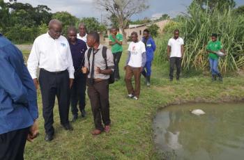 Intern Francis Banda speaks to the Zambia Bureau of Standards about farm certification.