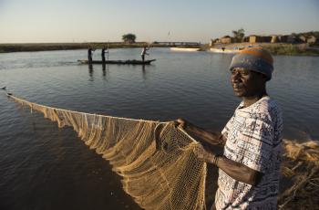 Fisherman in Mongu Harbour, Zambia. Photo by Anna Fawcus.