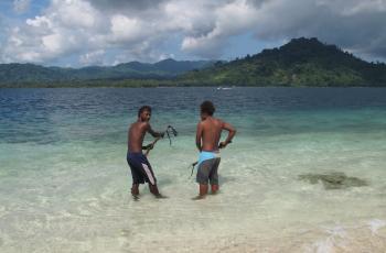 Spear fishing, Solomon Islands. Photo by Pip Cohen.