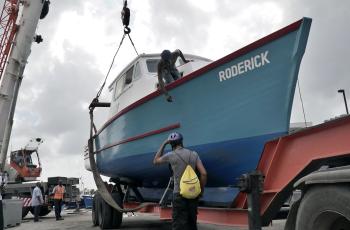 Boat preparation. Photo by WorldFish.
