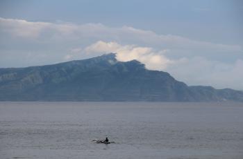 A man fishes in the ocean between Dili and Atauro in Timor-Leste. Photo by Holly Holmes.