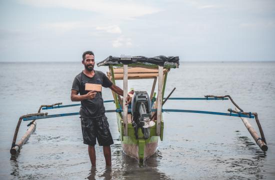 Handline fisher with tracker Timor-Leste © Joctan Lopes/WorldFish