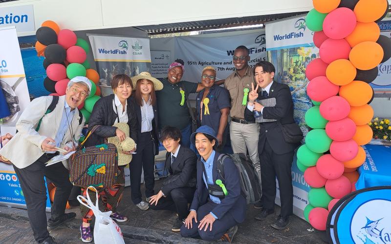 Entourage from Japan visits the WorldFish stand. Photo: Agness Chileya