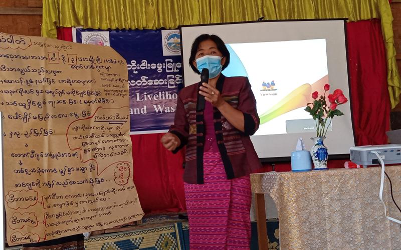 Daw Khin Soe Win, the Group Leader of Early Childhood Care and Development, speaks on the nutritional benefits of small fish.