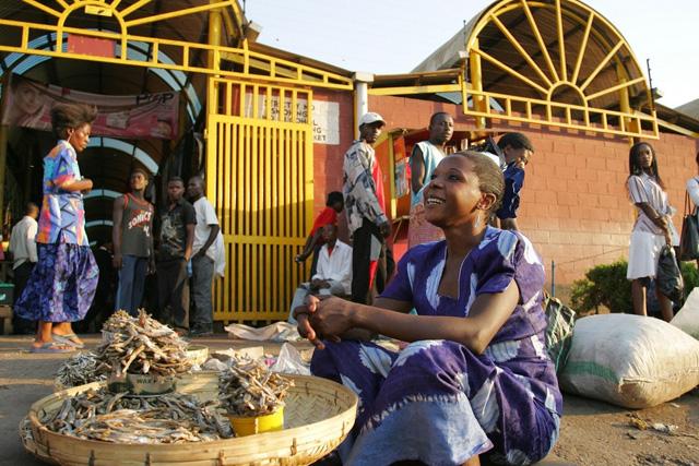 Woman selling fish in market, Zambia. Photo by Stevie Mann, 2007.