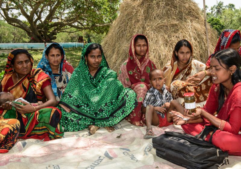 Field staff explaining the nutrition value of fish chutney in Sunamgunj, Bangladesh. Photo by Finn Thilsted.