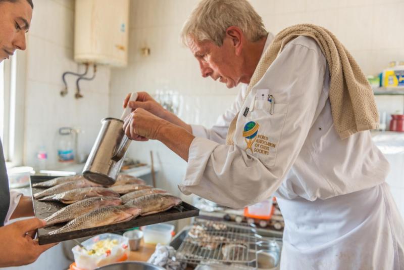 Chef Markus Iten cooking tilapia for a chef taste test, Abbassa, Sharkia, Egypt. Photo by Heba El Begawi, 2016.