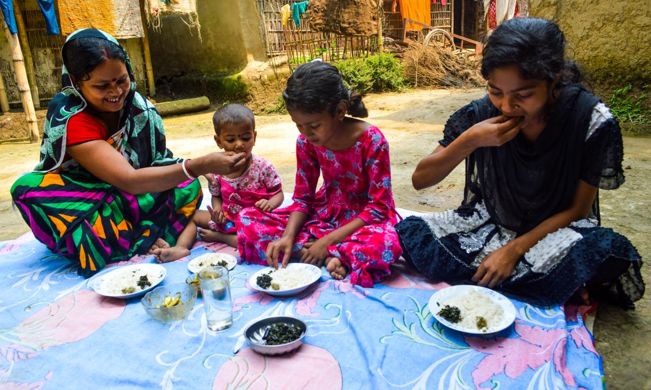 Pronoti Rani and her children eat nutrient-rich small fish in their meal in Moulavibazar, Bangladesh. Photo by Mohammad Mahabubur Rahman. 