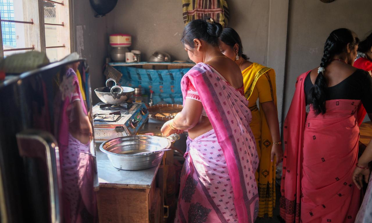 Preparing mola, a small, nutrient-rich fish, for cooking, a traditional and important source of vitamins and minerals in local diets in Assam. Photo by WorldFish.