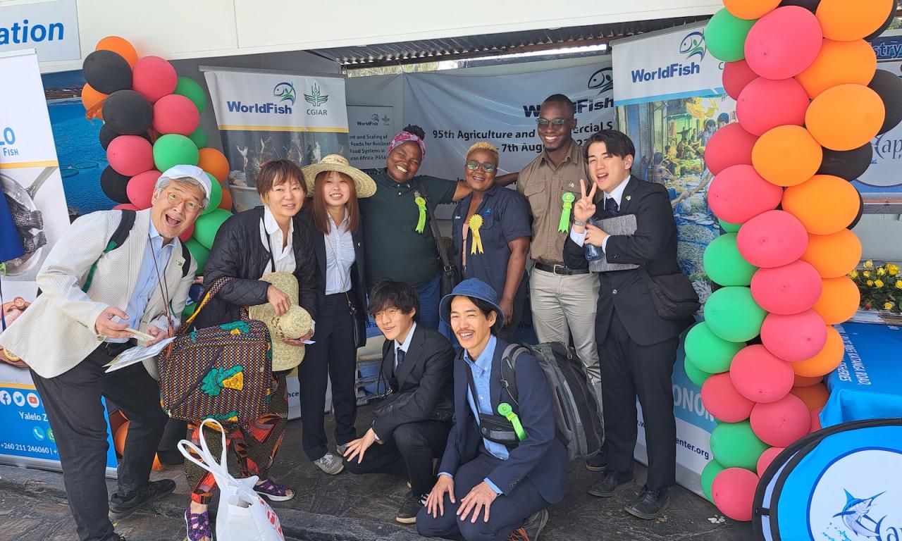 Entourage from Japan visits the WorldFish stand. Photo: Agness Chileya