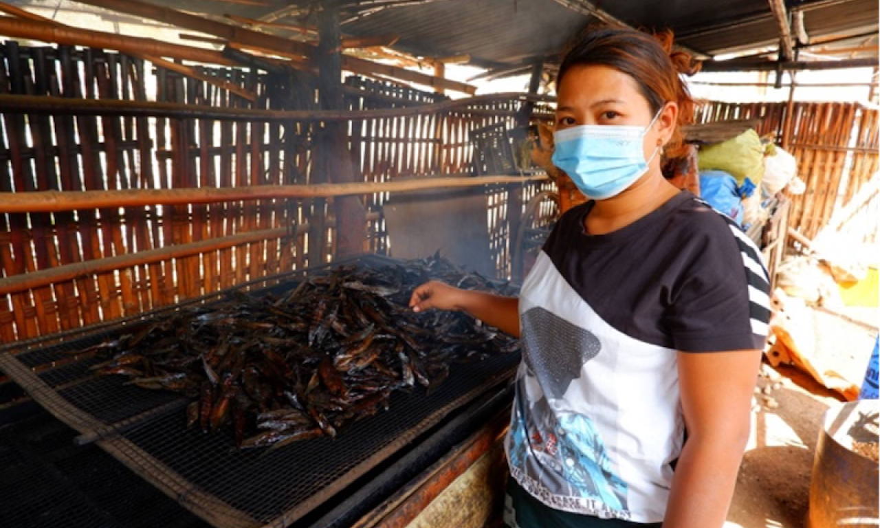 Win Chewa Htun produces smoked fish for a living together with her husband. Photo by Kyaw Moe Oo.