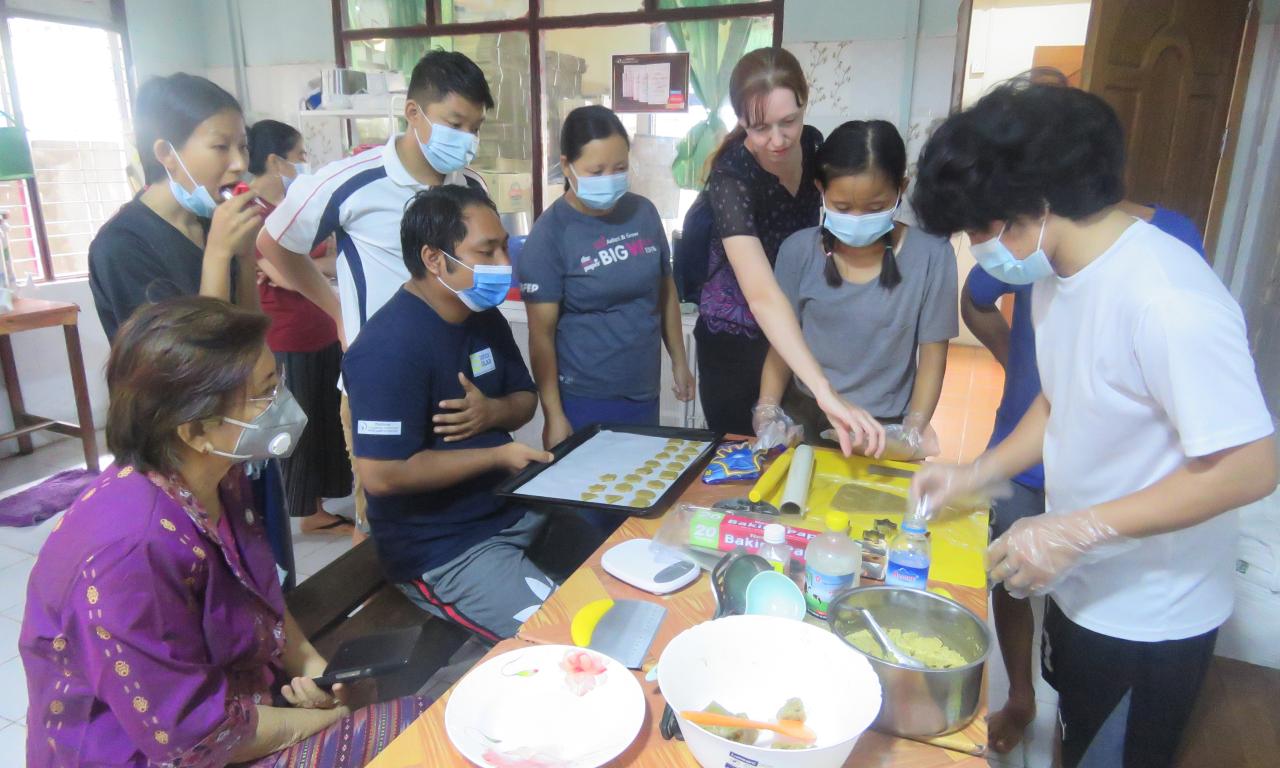 Youth prepare nutritious biscuits using FedWell’s dried small fish powder. Photo by Thomas Tha Thaw. 