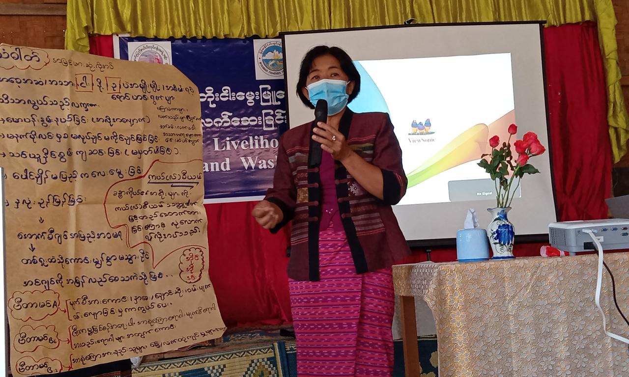 Daw Khin Soe Win, the Group Leader of Early Childhood Care and Development, speaks on the nutritional benefits of small fish.  