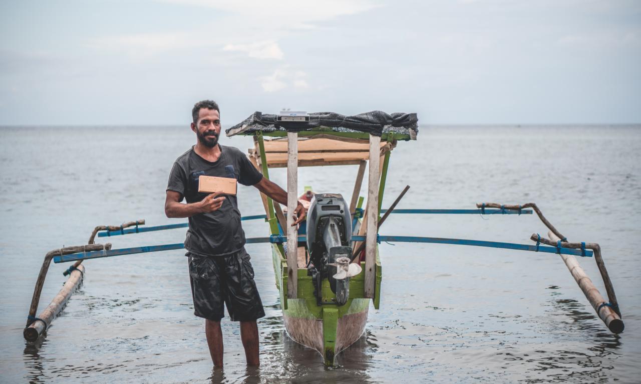 Handline fisher with tracker Timor-Leste © Joctan Lopes/WorldFish