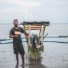 Handline fisher with tracker Timor-Leste © Joctan Lopes/WorldFish